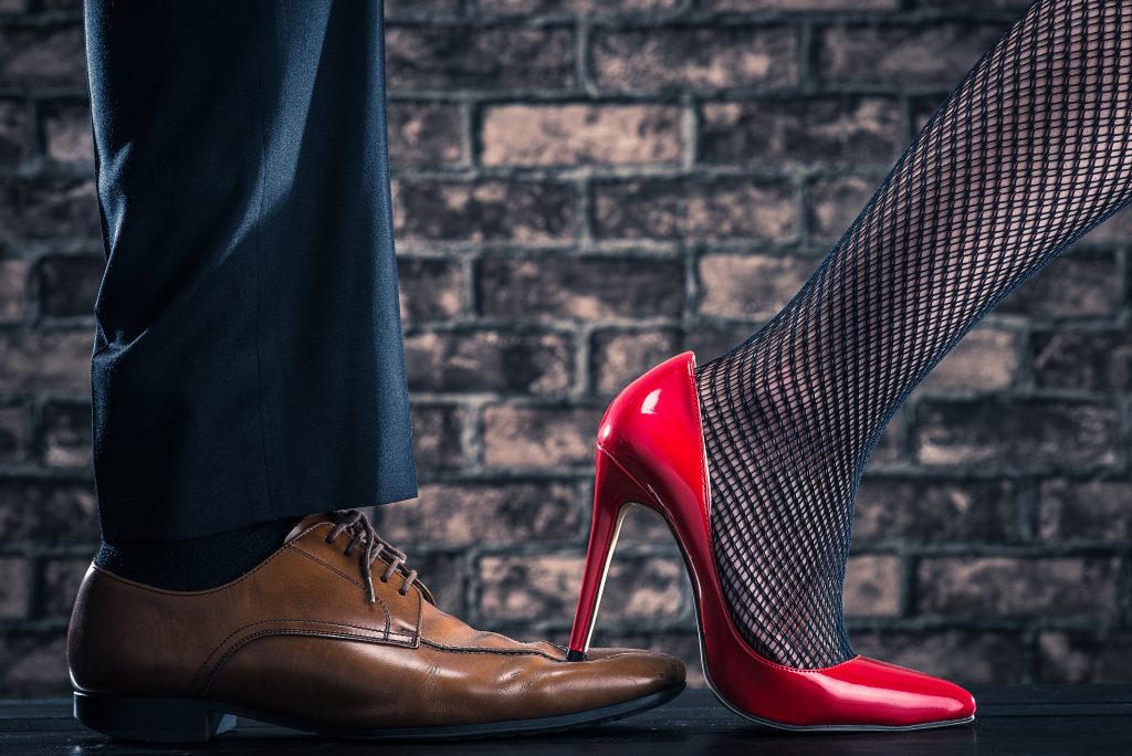women are stepping on the shoes of the man - OHS Canada MagazineOHS ...