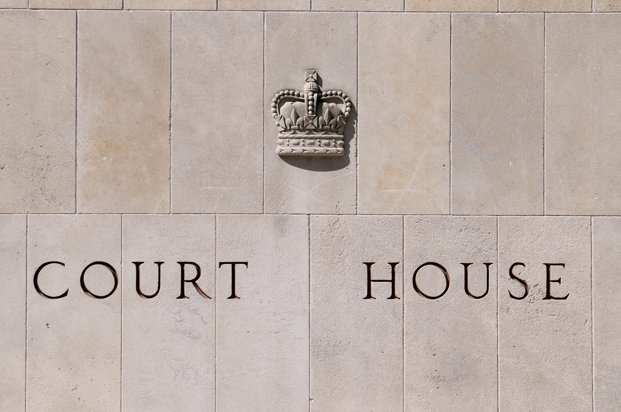 Court house carved on stone blocks with royal emblem